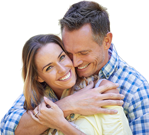 Smiling couple embracing and enjoying a happy, healthy lifestyle